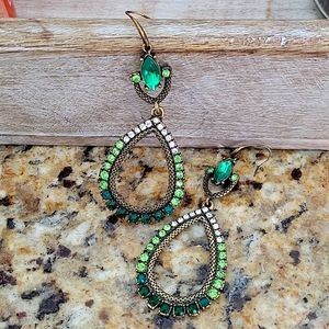 Green rhinestone earrings. They are approximately 2.5 inches.